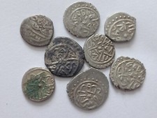 Eight silver Ottoman coins.