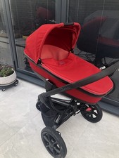A baby pram with a carrycot