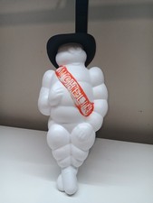 retro michelin man with cowboy hat truck mascot