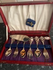 6 boxed cake forks & spoon with slice with rose design on the handle