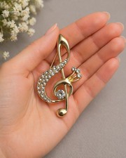 Elegant Gold Music Note Brooch