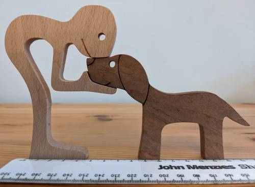 Wooden carved man and dog - carved,
