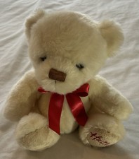Hamleys teddy bear with a red ribbon