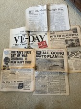 Four assorted newspapers on