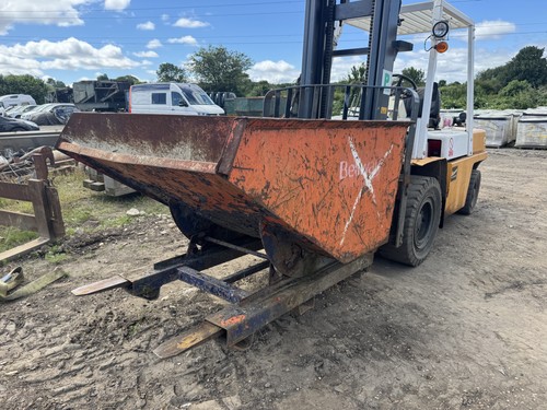 Forklift tipping skip bellway - forklift,