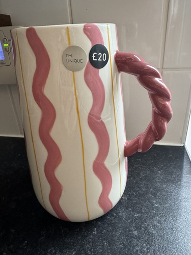 Next pink white twist handle - &,