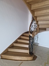 Oak curved staircase with iron