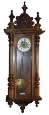 Antique Vienna regulator wall clock in working condition.
