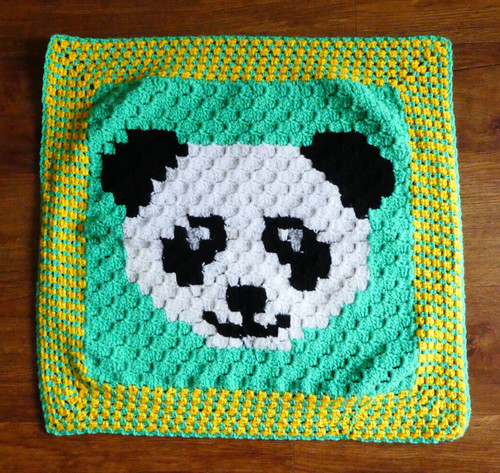 Hand crocheted childs panda - hand,