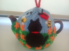 HAND KNITTED TEA COSY FOR SMALL TEAPOT -CAT IN THE MARIGOLDS 