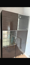 Two Ikea display cabinet with glass doors and lights.  Glass shelf in glass unit
