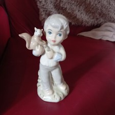 Ladro figurine. Boy with squirrel