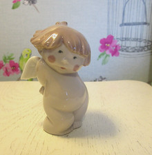 Lladro/Nao  from the Cute cheeky cherub series  "  Naughty me "
