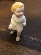 small victorian bisque figure of a child sitting