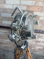 Vintage search light decorative lamp on adjustable tripod base.