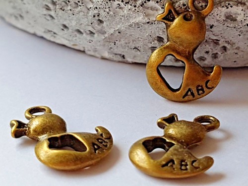 Duck charm antique - 10,