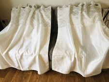 Dunelm ivory eyelet curtains , good condition width 44"each 54" drop