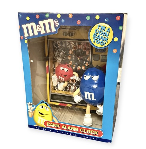 Alarm clock and coin - m&m's,