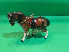 Vintage small porcelain pony with reins and harness
