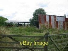 Photo 6x4 Agricultural buildings housing farming machinery at Cow Carr Th c2006
