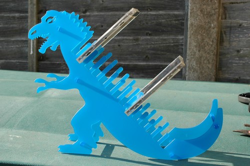 Dinosaur rack holder - dinosaur, cd