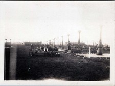 WW1 Photo of Soldiers Seated Beside Artillery Shell Displays