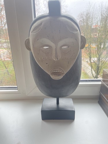 African mask hand - hand, on