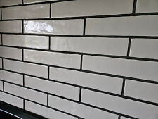 Ceramic tiles,  brick shaped, glazed, cream coloured, Spanish, unused.