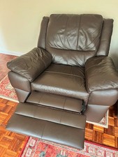 swivel armchair with manual footrest