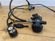 Scubapro MK25 with X650 2nd stage plus Octupus Apex T50, with gauges and hose.
