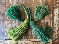 Four longbow arrow tassels