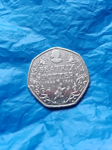 Fifty pence piece showin - showin, a