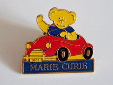 Marie Curie pin badge red car