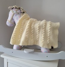 Hand knitted baby blanket in