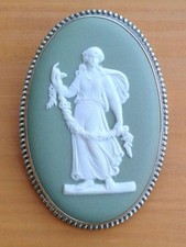 WEDGWOOD NEO CLASSICAL GREEN JASPERWARE SILVER RIMMED OVAL BROOCH.