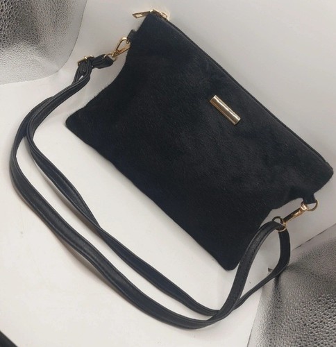 Black and gold leather pony - and,