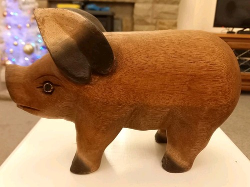 Hand carved wooden pig - hand,