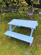 Childrens' picnic table in light chalky blue. In fair condition.
