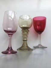 Three Coloured, Stemmed Wine Glasses.