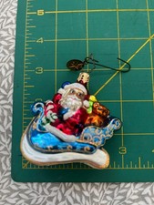Radko Santa in a blue sleigh