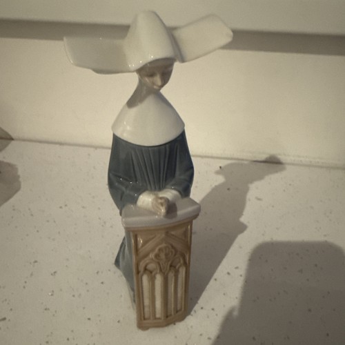 Lladro figurine kneeling nun - lladro,
