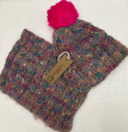 Hand knitted bobble hat and - hand,