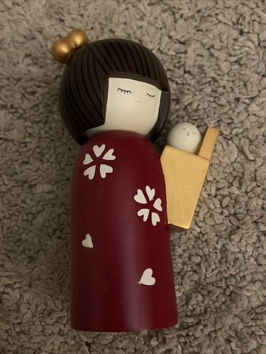 Japanese kokeshi holding baby - kokeshi,