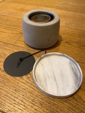 Desktop fire pit with concrete base and bamboo sticks