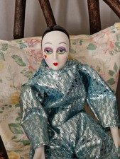 Haunted Doll Hazel, adult woman, active, positive. Clown style doll.
