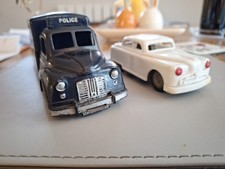 VINTAGE TINPLATE AND PLASTIC FRICTION DRIVE POLICE VAN AND RED CROSS CAR