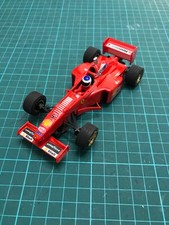 Scalextric type slot car - Ninco Ferrari F310B F1 racing car, #5 red M Scumacher