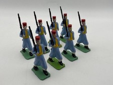 Plastic toy soldiers marching