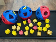 Three vintage Tupperware shape sorter balls with 21 shapes