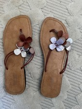 leather flip flops with flower trim